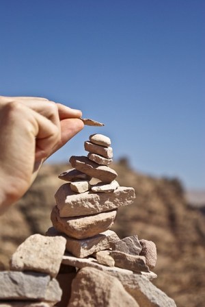 Photo of stacking small stones in the desert
