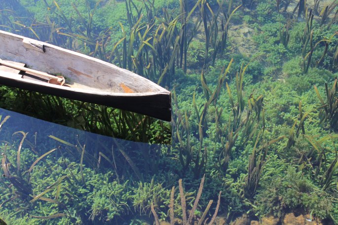 Photo of a canoe in clear water