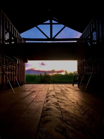 Photo of open sky seen through barn doors