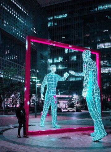 Photo of glowing statues at night